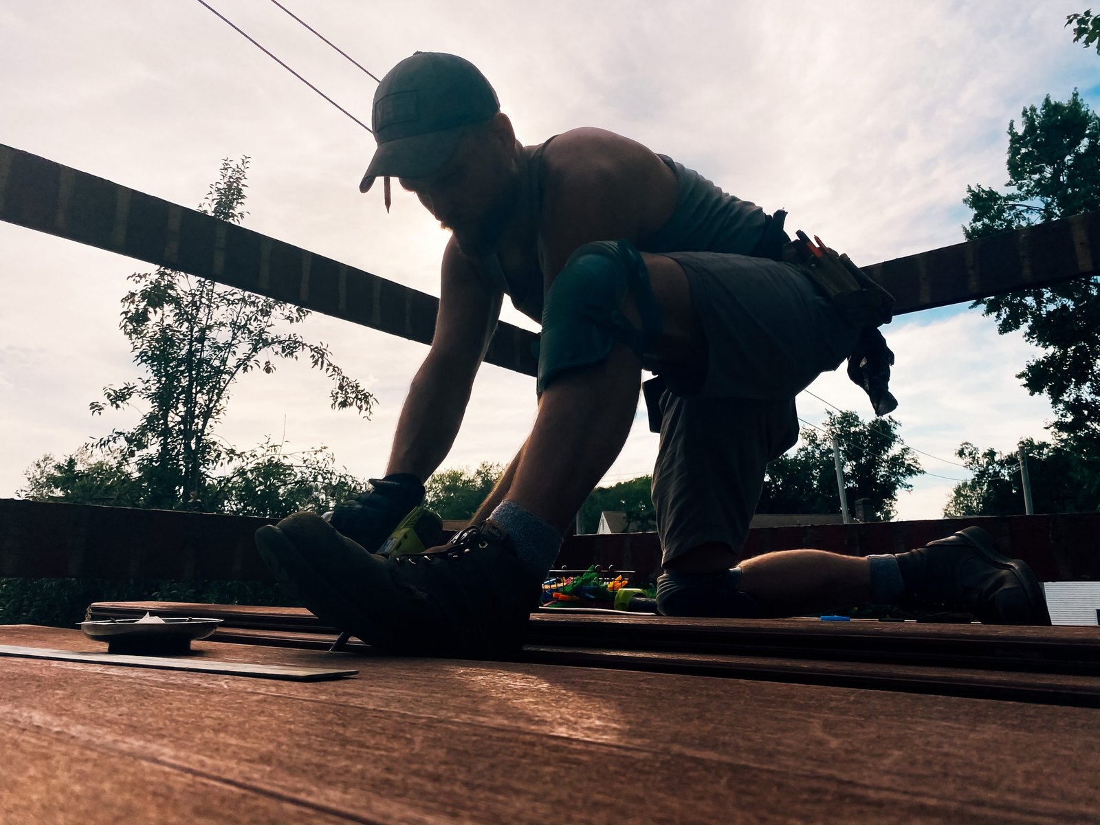 a-man-working-hard-building-a-deck-physical-work-h-9FBHBED
